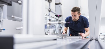 A worker examines the quality of products