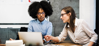 Two women working together