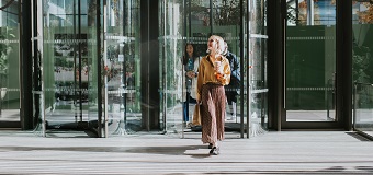 Woman entering commercial office building